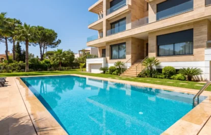 Modern Rabat apartment building with travertine facade, landscaped garden, palm trees and outdoor pool