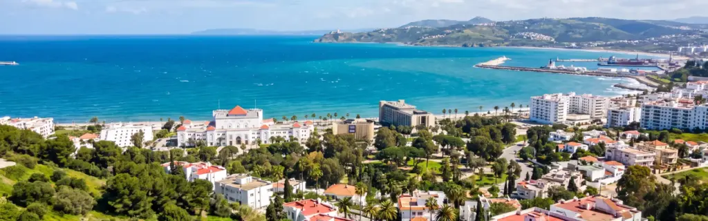 Aerial view of the bay, port and hillside villas in a Tanger neighbourhood guide to the city's prime areas